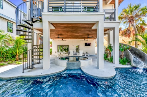 house with pool and spiral stair case